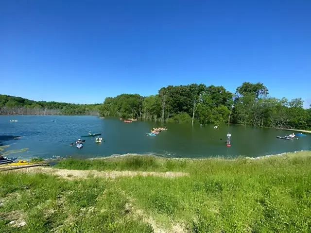People kayaking on a beautiful recreational pond constructed in Central Illinois